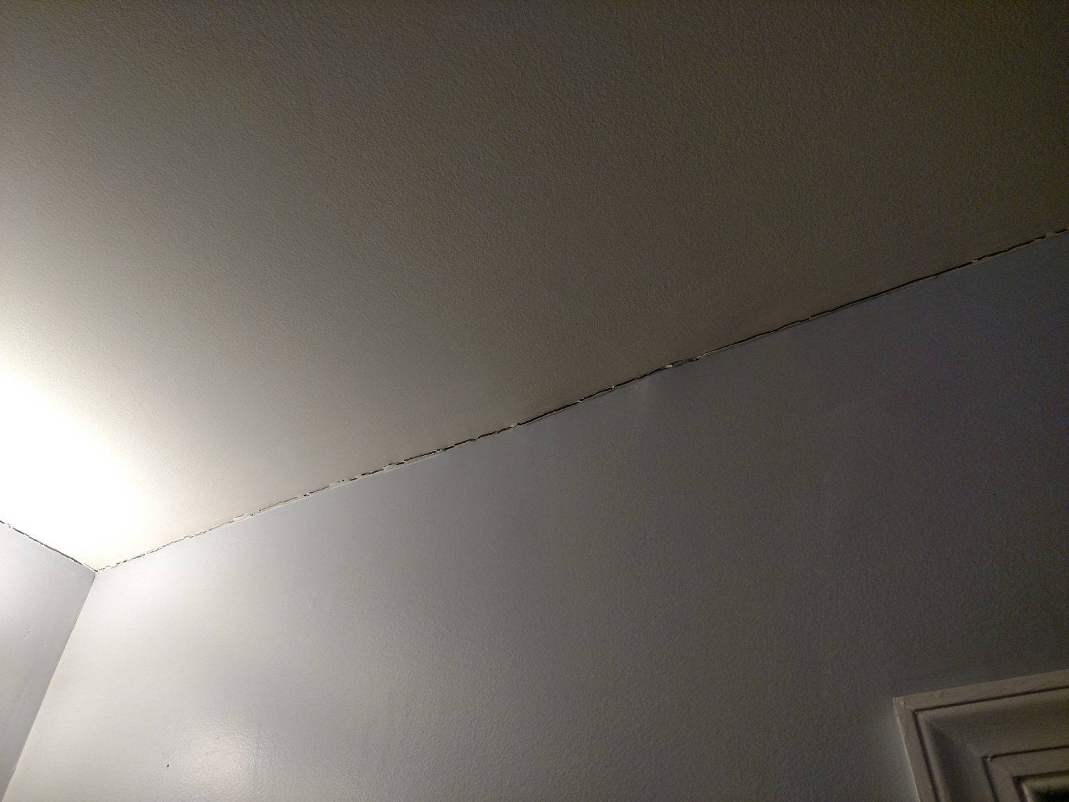 Understanding the Causes and Solutions for a Crack Between Ceiling and
